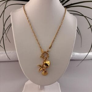 dd7a11a6a78f429eae5ca0f534403ffetplv-t5fjg24jzw-origin-jpeg.jpeg Collier TRINITY en acier inoxydable plaqué Or